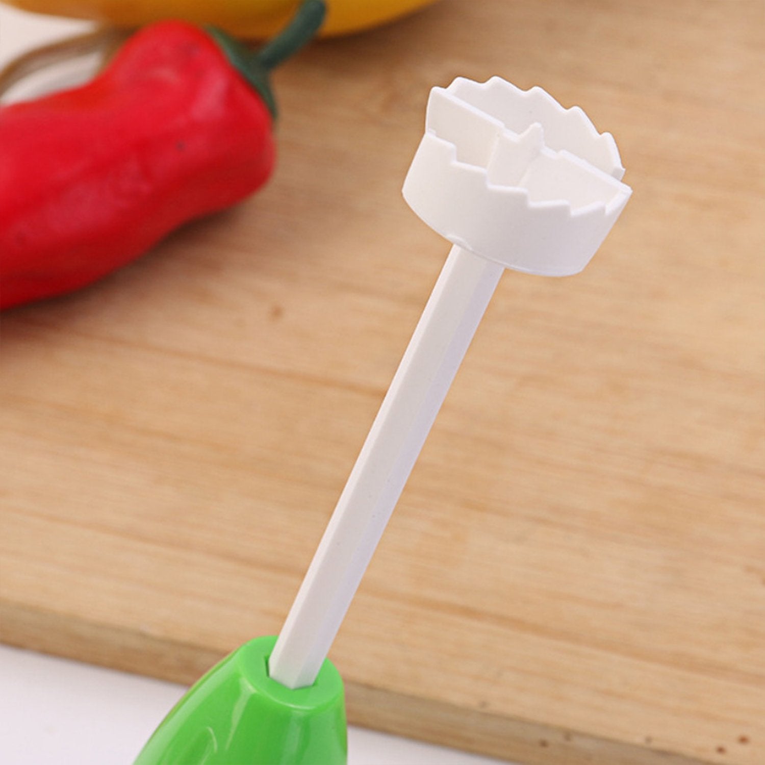 Wukusy Veg Drill spiralizer kitchen tool for creating stuffed vegetables and vegetable spirals, shown in use on fresh produce.
