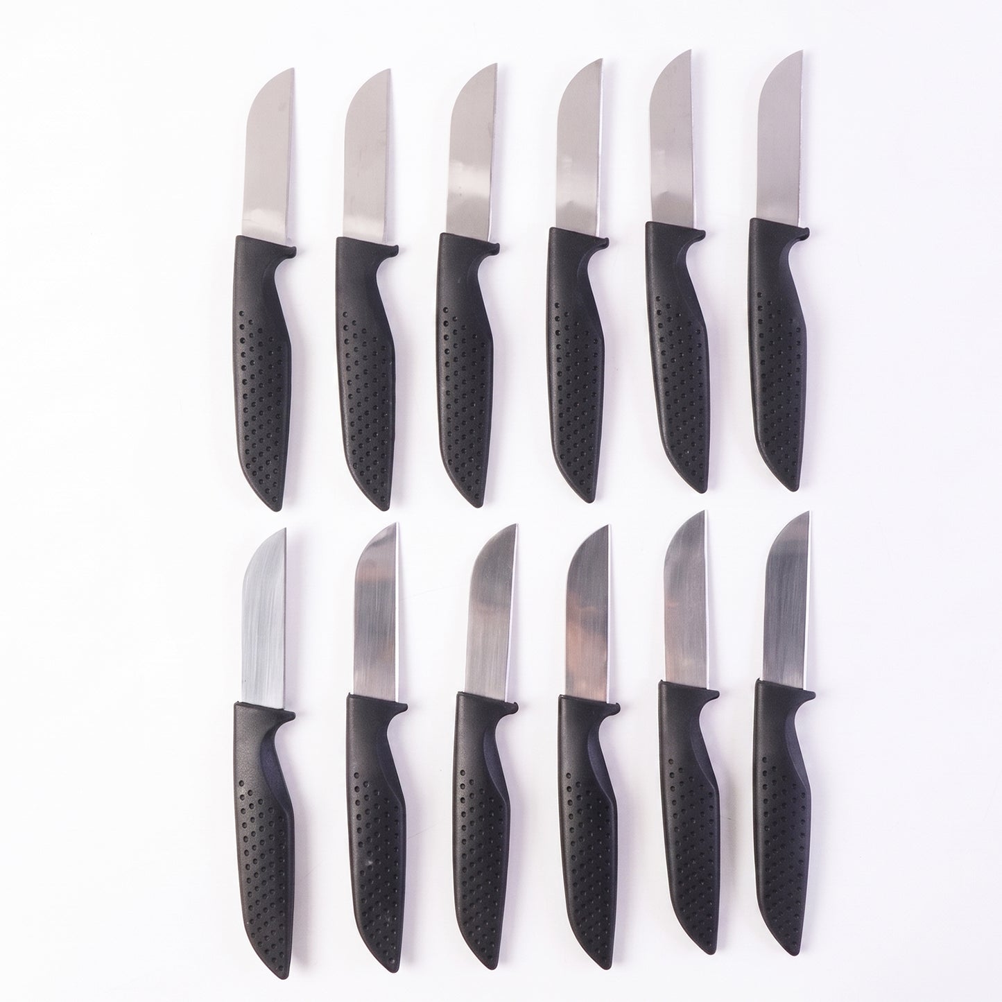 Wukusy 12-piece kitchen knife set with ergonomic stainless steel chef knives arranged on a countertop.