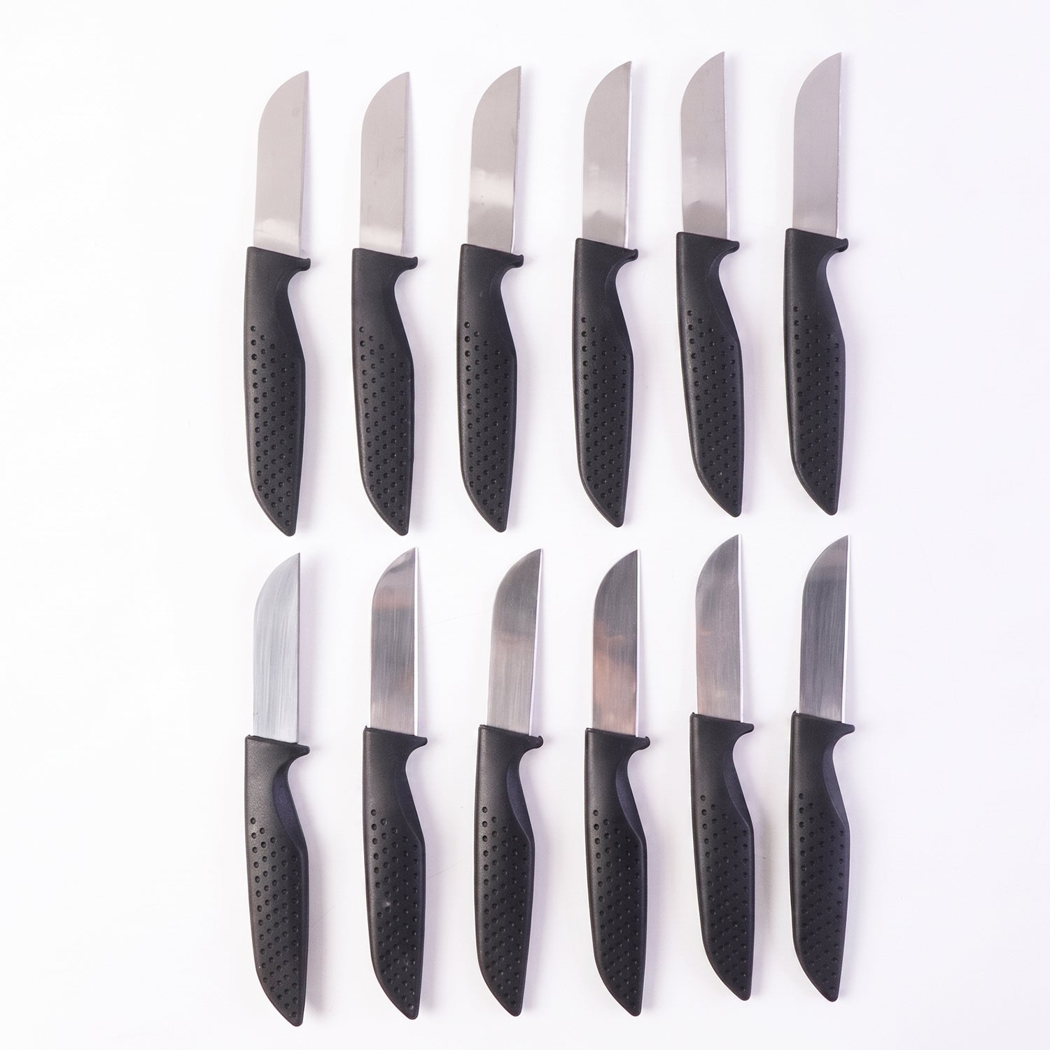Wukusy 12-piece kitchen knife set with ergonomic stainless steel chef knives arranged on a countertop.