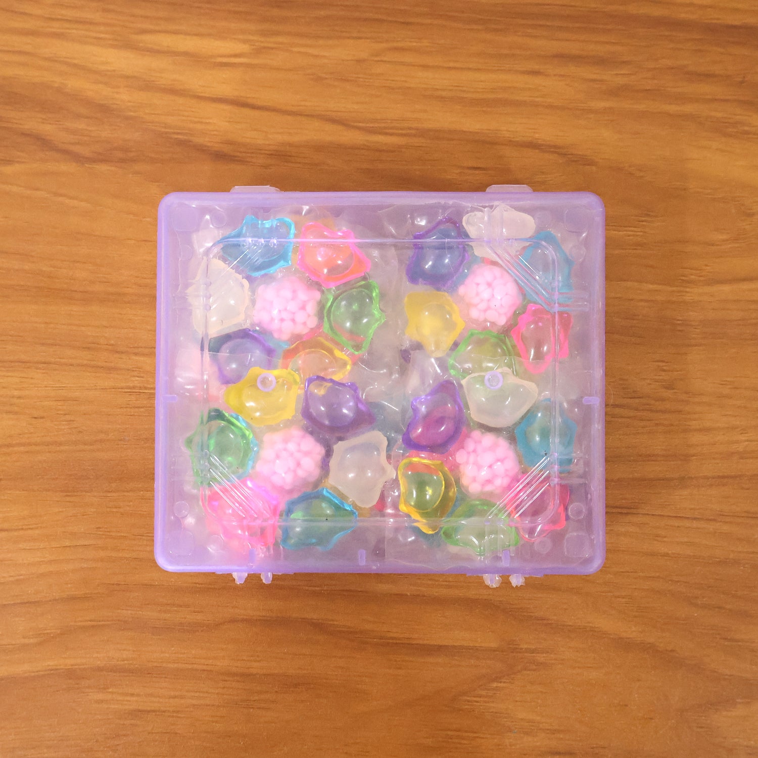 Colorful laundry detergent pods by Wukusy in a 25-piece pack, showcasing vibrant multi-colored capsules for effective cleaning.