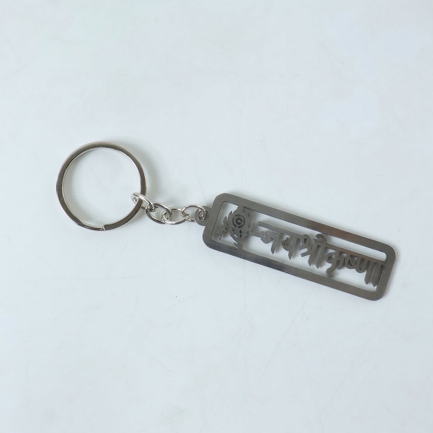 Premium metal Jay Shri Krishna engraved keychain by Wukusy, featuring detailed Krishna deity design on a durable metal keychain.