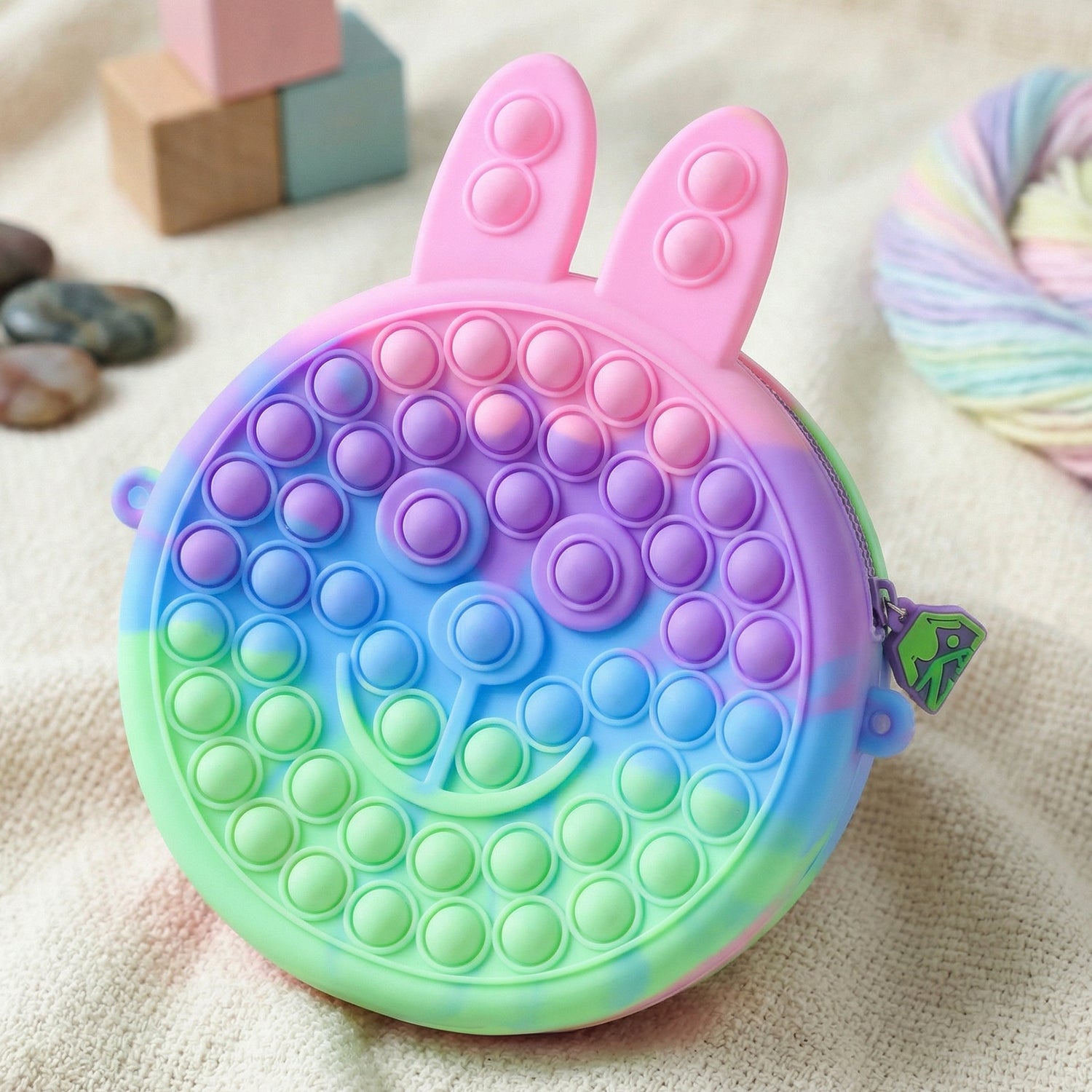 Wukusy cute caterpillar-shaped silicone pop it pencil pouch with colorful segments, ideal for stationery storage and fun organization.