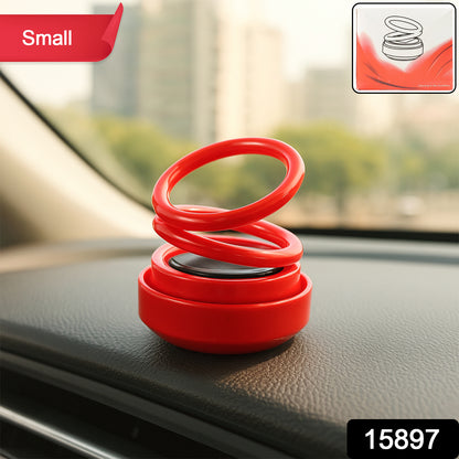 Small Wukusy solar car aroma air freshener hanging from a car interior rearview mirror, compact and decorative automotive accessory.