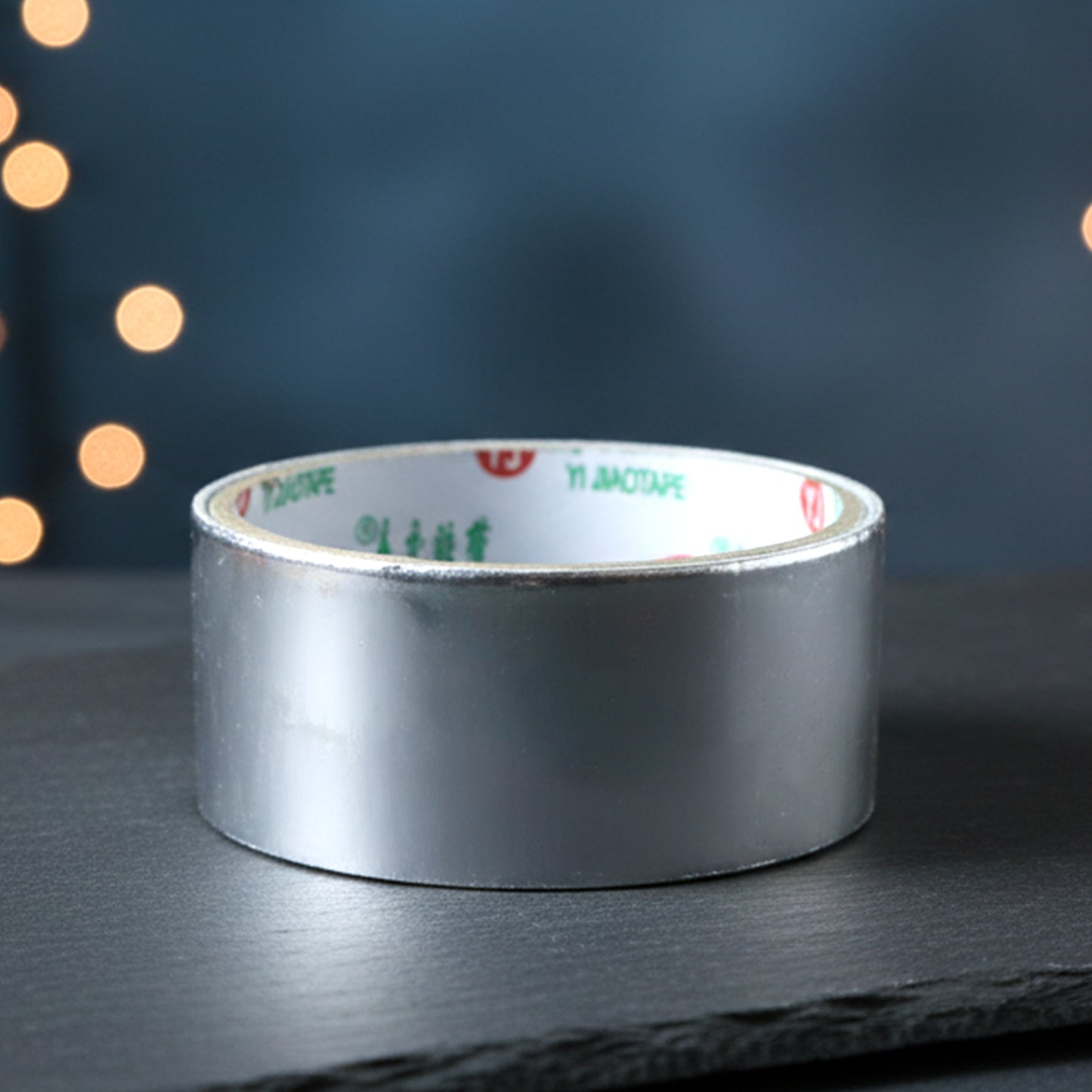 Wukusy heavy-duty aluminium foil adhesive tape, 8540 mm length, shown in a roll ready for sealing and insulation tasks.