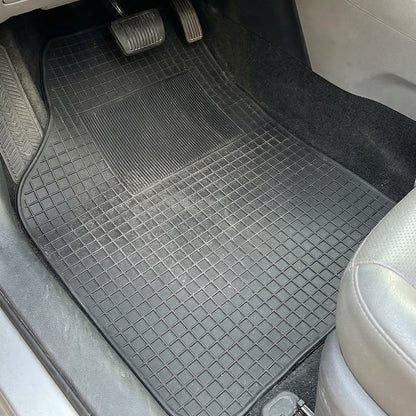 Set of four heavy-duty car floor mats by Wukusy, durable rubber mats designed for universal fit and protection.