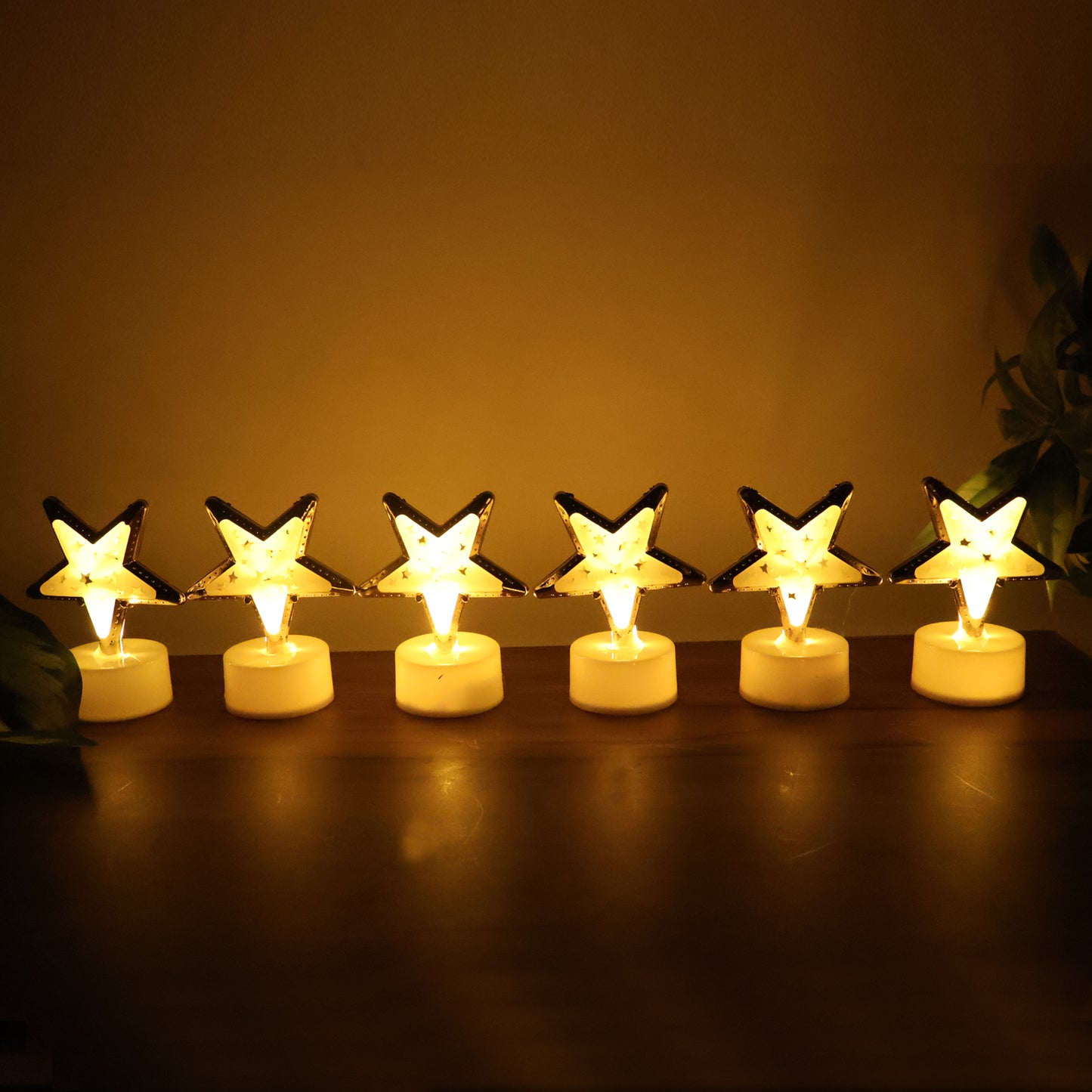 Set of 12 decorative star-shaped flameless LED candles for home decor by Wukusy, showcasing warm light and star design.