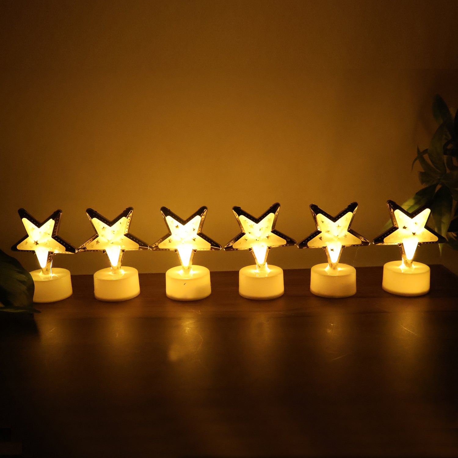 Set of 12 decorative star-shaped flameless LED candles for home decor by Wukusy, showcasing warm light and star design.