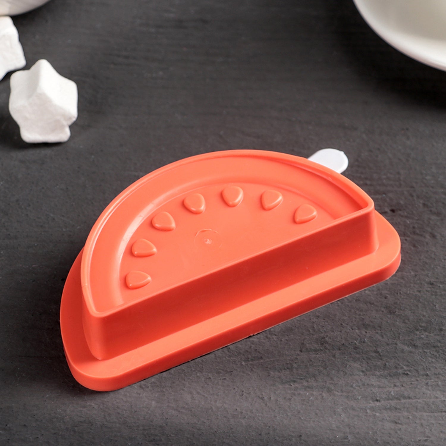 Silicone watermelon popsicle mold by Wukusy with four cavities for DIY ice pops and ice cream treats in a kitchen setting.