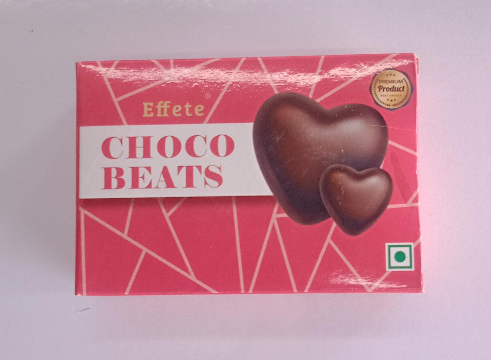 Wukusy Choco Beats heart-shaped chocolates with rich, smooth milk chocolate filling and decorative chocolate accents.