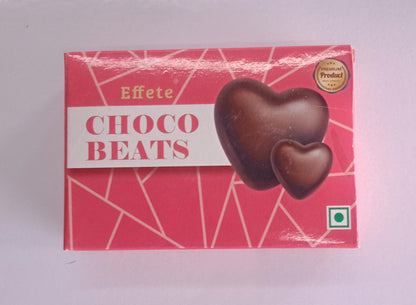 Wukusy Choco Beats heart-shaped chocolates with rich, smooth milk chocolate filling and decorative chocolate accents.