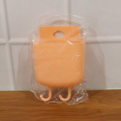 Wall-mounted plastic mobile charging holder by Wukusy, featuring multiple slots for organizing and charging smartphones.
