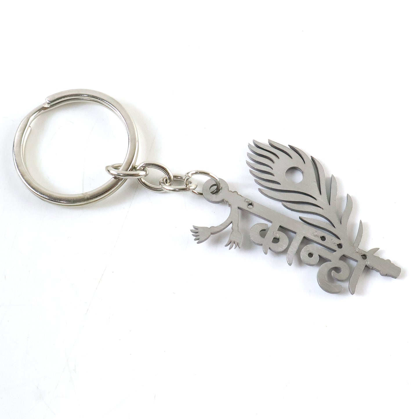 Wukusy premium metal Kanha keychain featuring intricate design, attached to a keyring with a decorative charm.