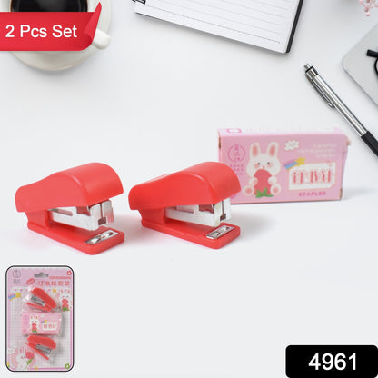 Wukusy mini office stapler with staples and pin set, compact desktop office supply for quick paper fastening.