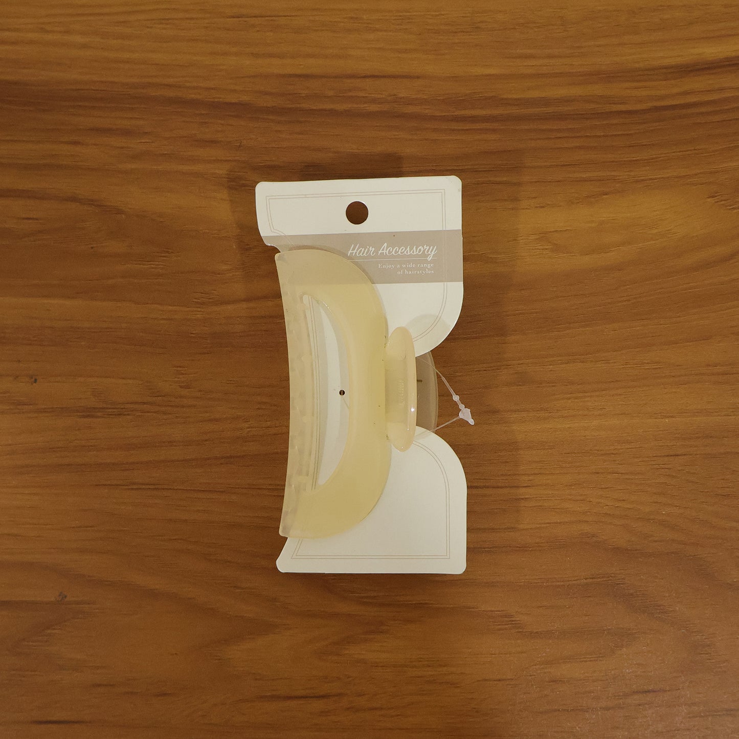 Large Wukusy hair claw clip holding styled hair, showcasing its elegant design and sturdy grip for hair styling.