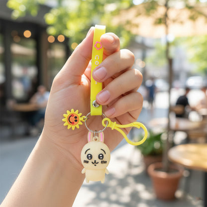 Cute cartoon bunny silicone keychain with decorative strap from Wukusy, featuring a soft, colorful bunny design on a keyring.