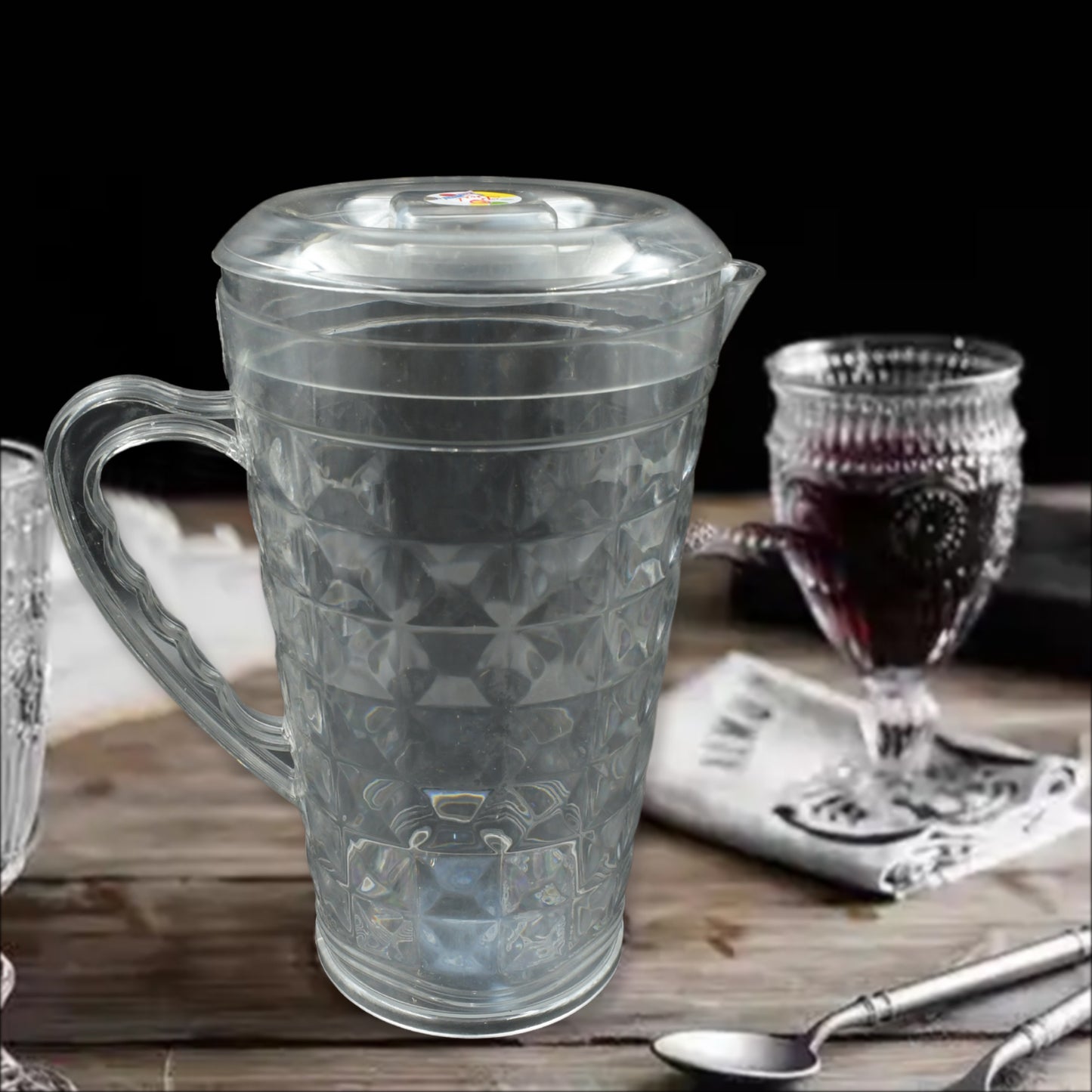Transparent plastic pet jug with lid, reusable BPA-free water container by Wukusy for home or restaurant use.