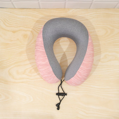Pink and grey U-shaped travel neck pillow with drawstring toggle from Wukusy, designed for comfortable support during travel.