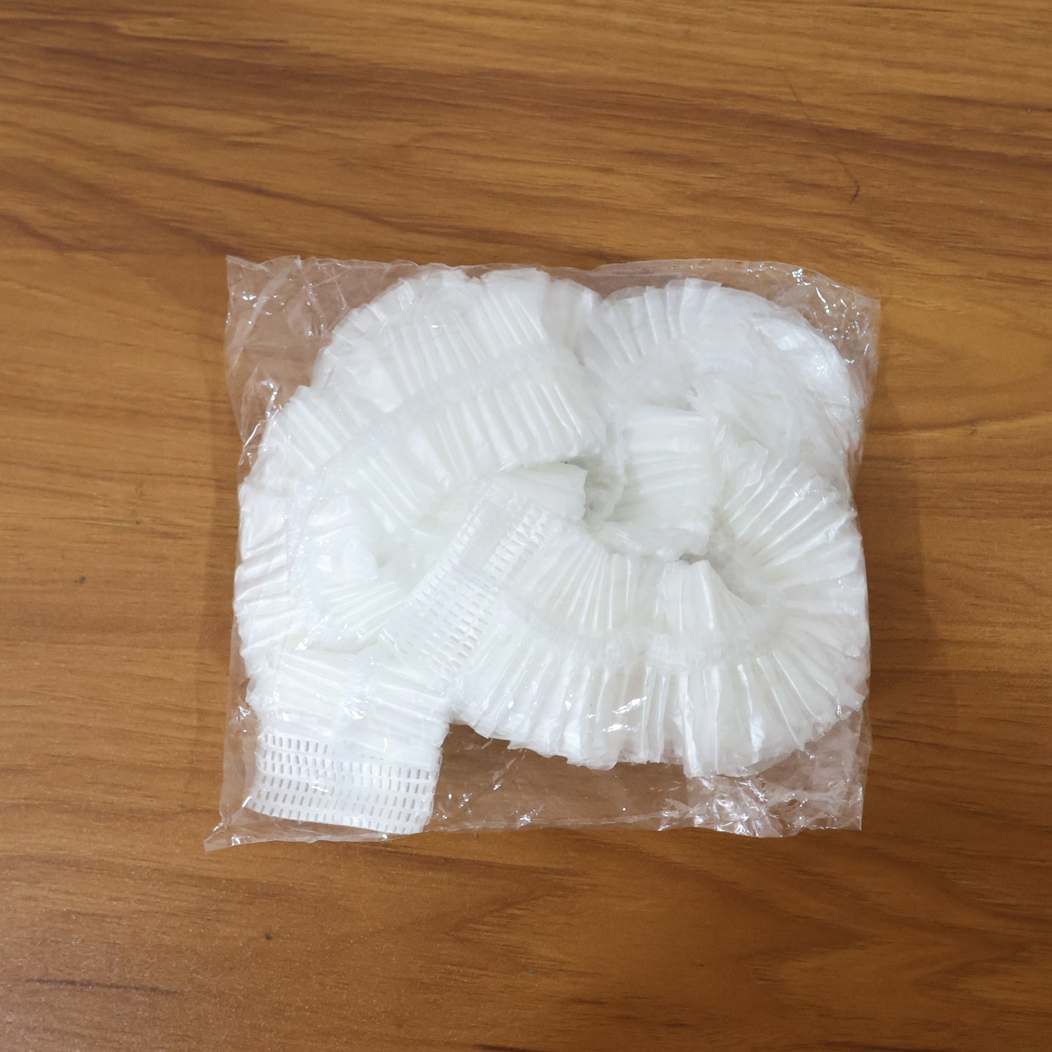 Wukusy Big Disposable Plastic Activa Cover, automotive protective cover for scooter seats, in clear plastic with branding details.