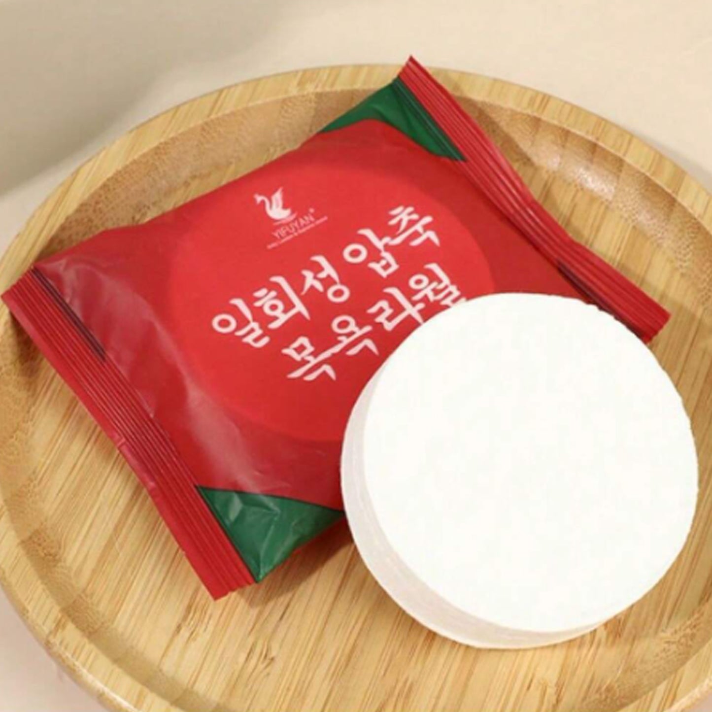 Wukusy compressed cotton towel for travel and outdoor use, shown as a compact, portable tissue towel in a camping or hiking setting.