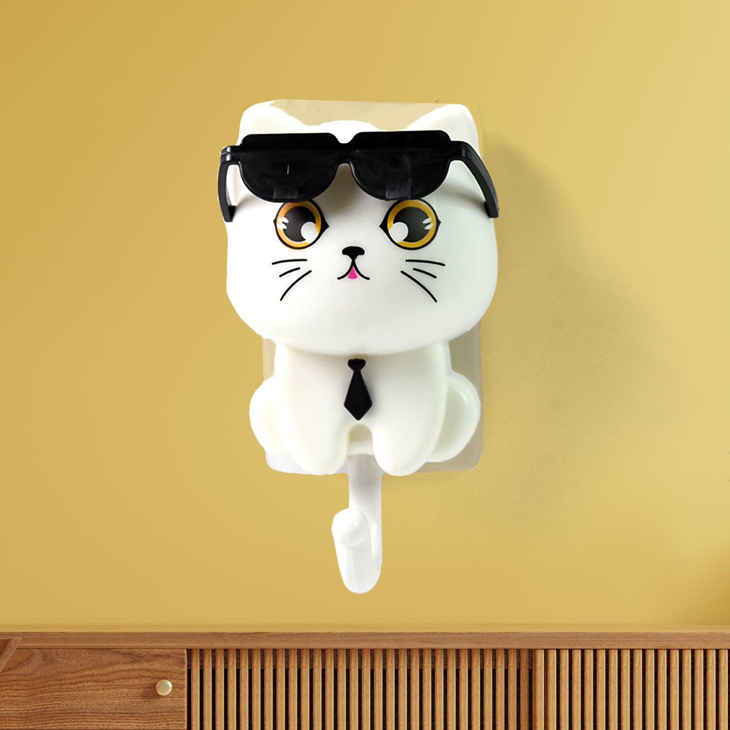Cute cat-shaped wall key hook with sunglasses, made of durable material, designed for home organization and decor.