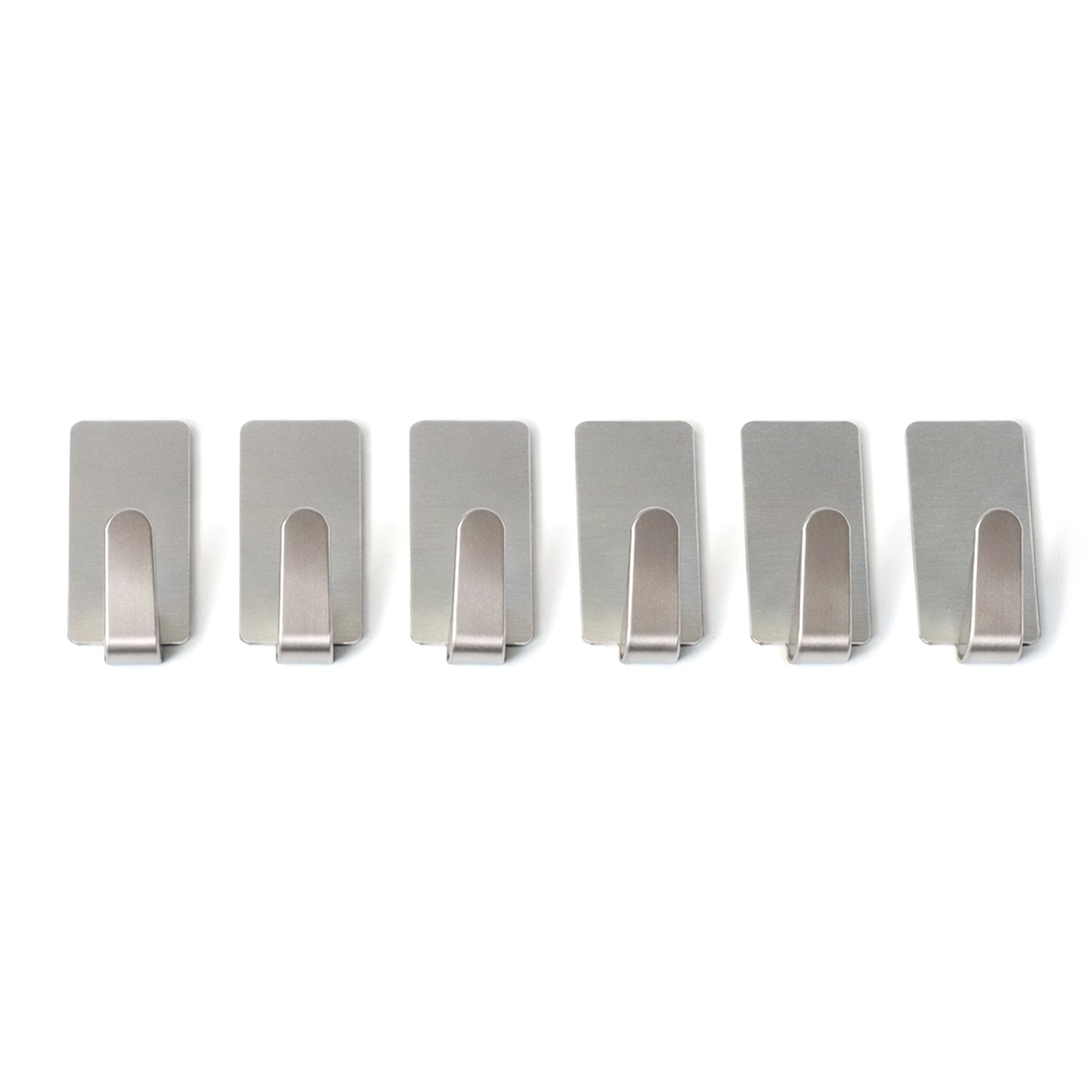 Set of six Wukusy self-adhesive wall hooks mounted on a wall, showcasing versatile hanging options for home organization.