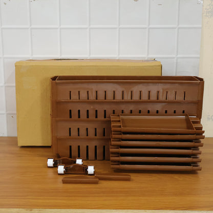 Wukusy four-layer plastic storage rack with wheels, versatile and portable for organizing home or office space.