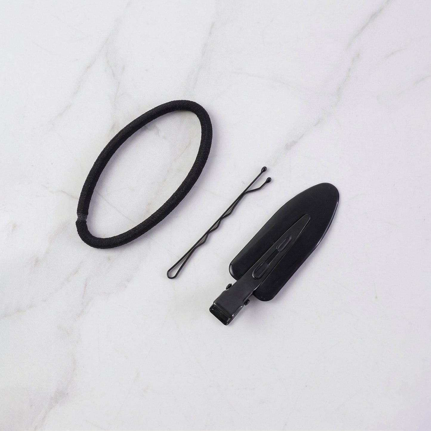 Wukusy multipurpose hair accessories combo set showing hair clips, elastics, and pins on a neutral background