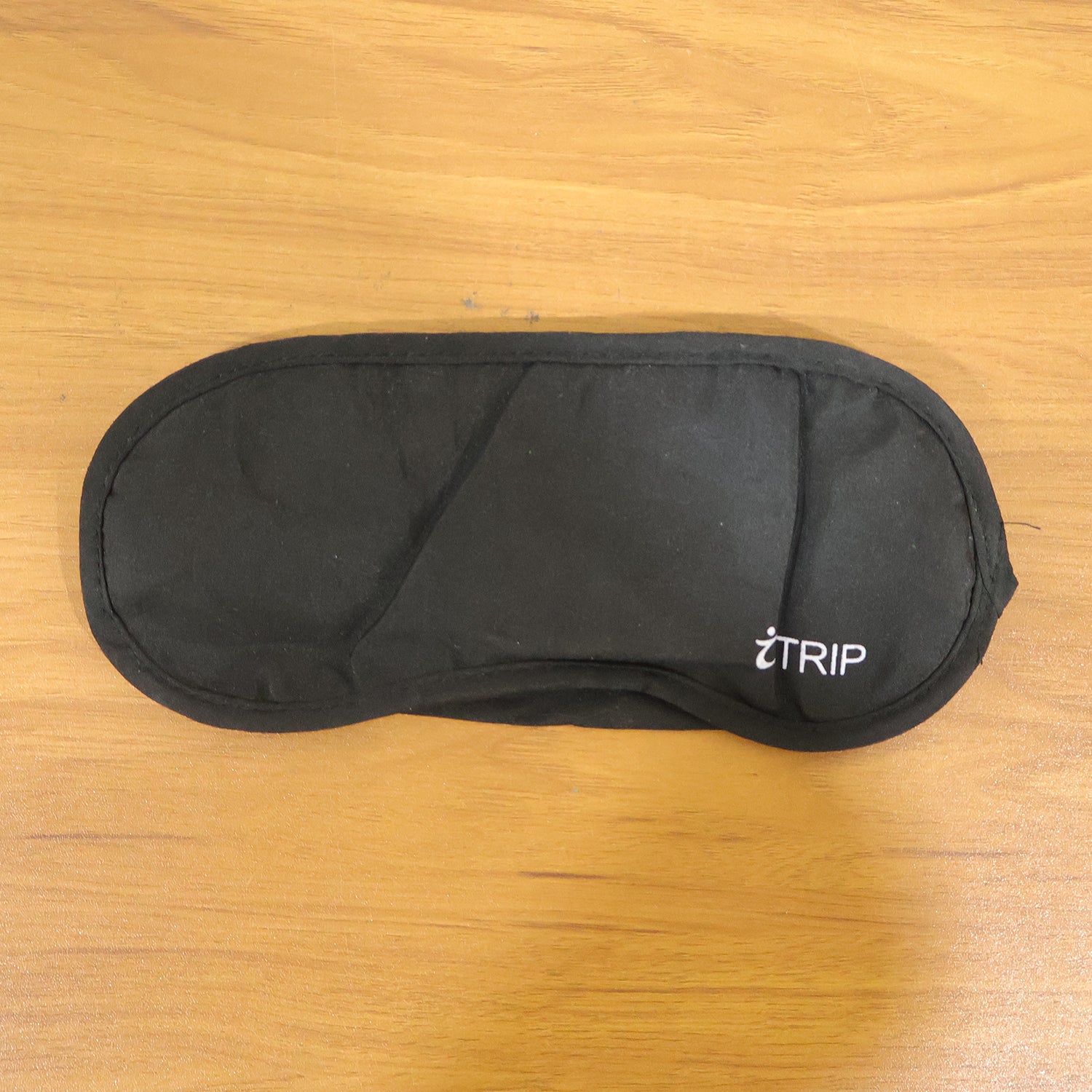 Wukusy premium soft padded sleep eye mask showing smooth, black fabric with gentle contours for comfortable sleep.