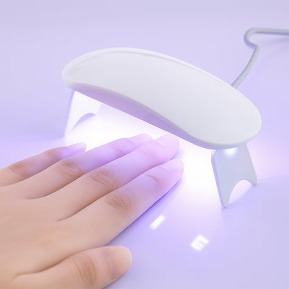 Wukusy mini portable UV LED nail lamp for gel nail polish curing, compact design with multiple UV light beads for effective drying