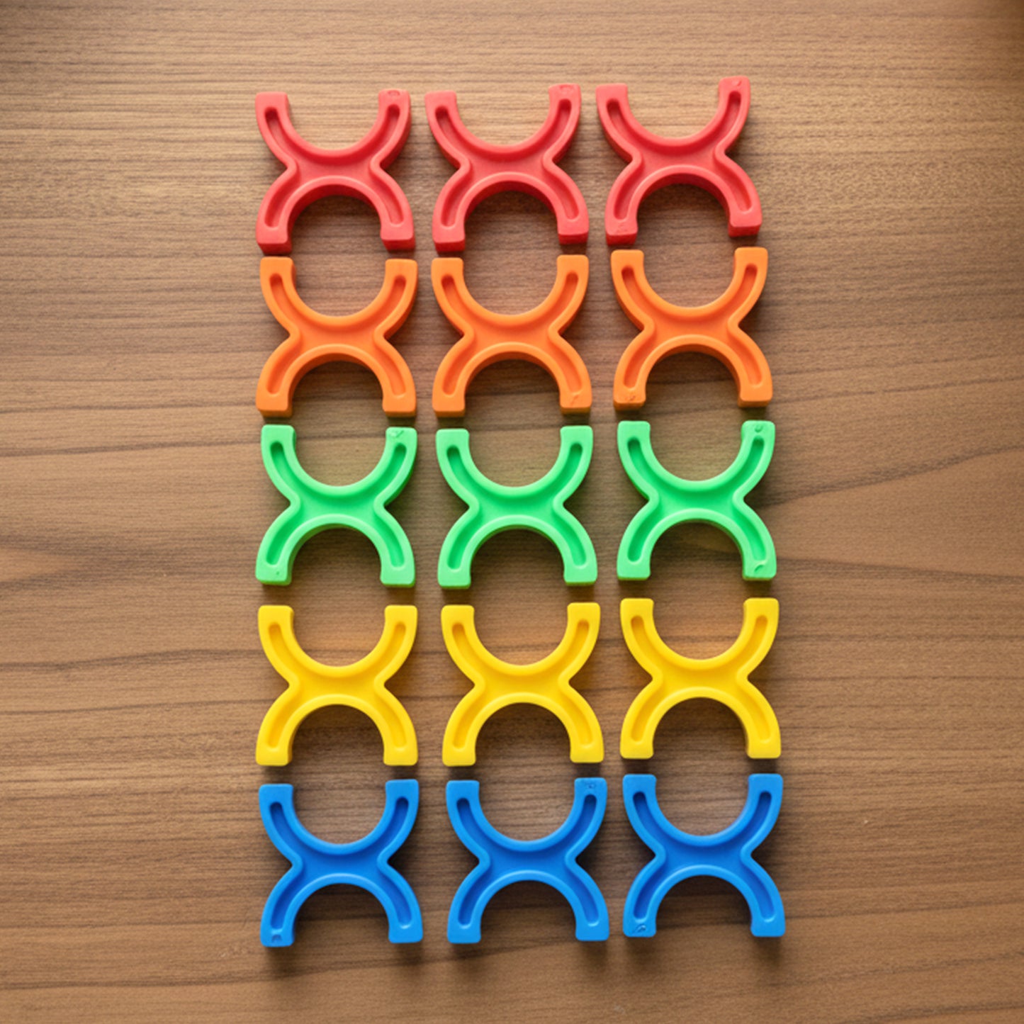 Colorful interlocking stacking toy blocks by Wukusy, arranged in a playful pattern, showcasing vibrant colors and smooth edges.