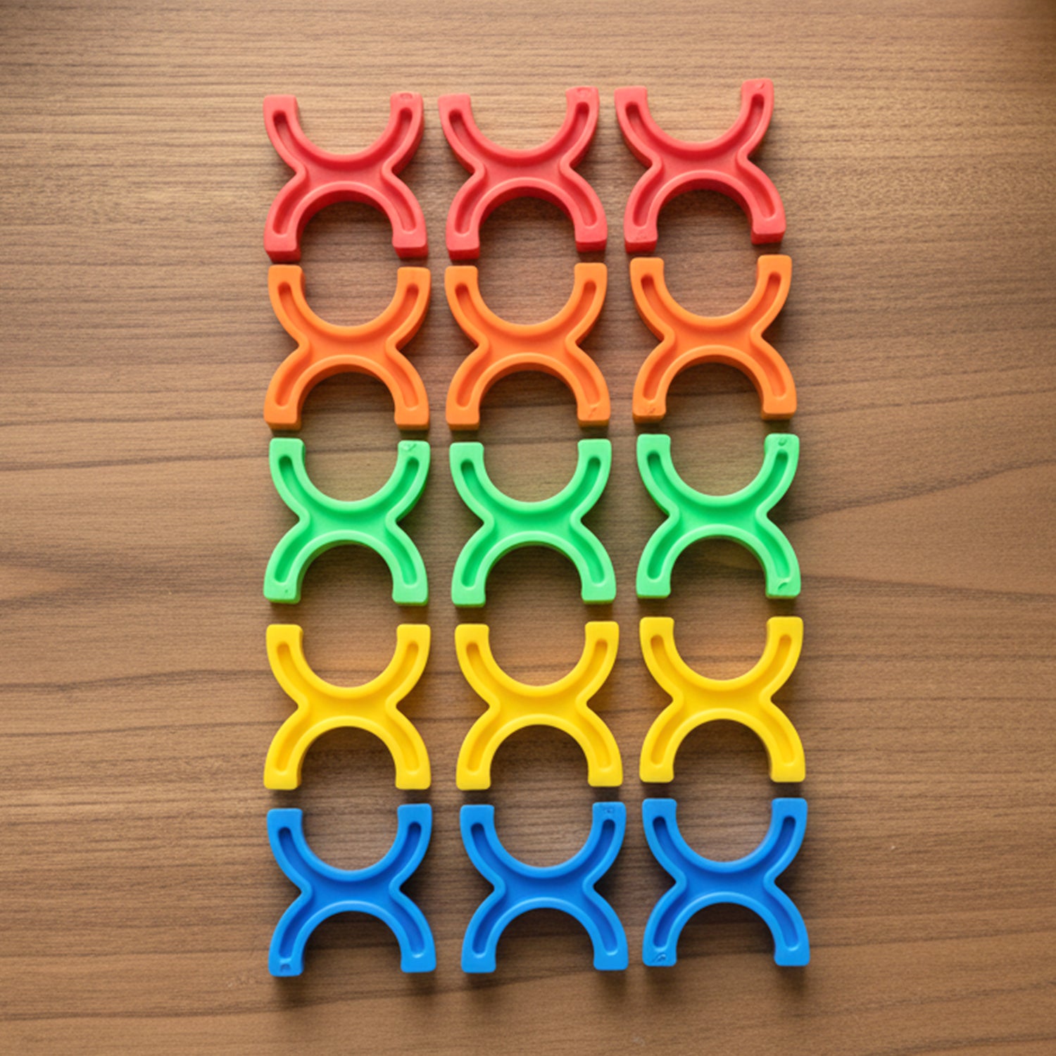 Colorful interlocking stacking toy blocks by Wukusy, arranged in a playful pattern, showcasing vibrant colors and smooth edges.
