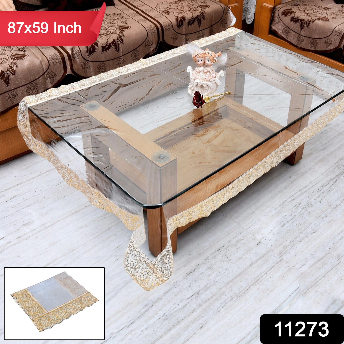 Transparent PVC table cover measuring 87x59 inches by Wukusy, showing smooth, clear plastic surface on a dining table.