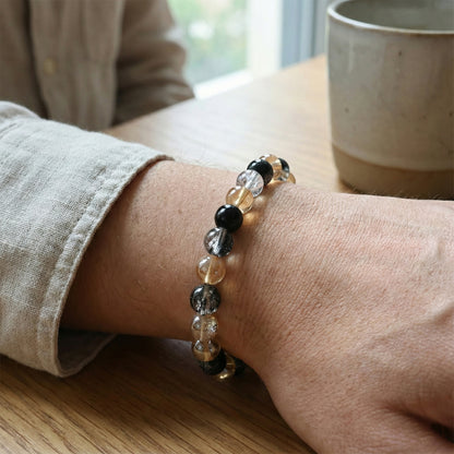 Elegant dual-tone crystal beaded stretch bracelet by Wukusy featuring sparkling beads on a flexible band.
