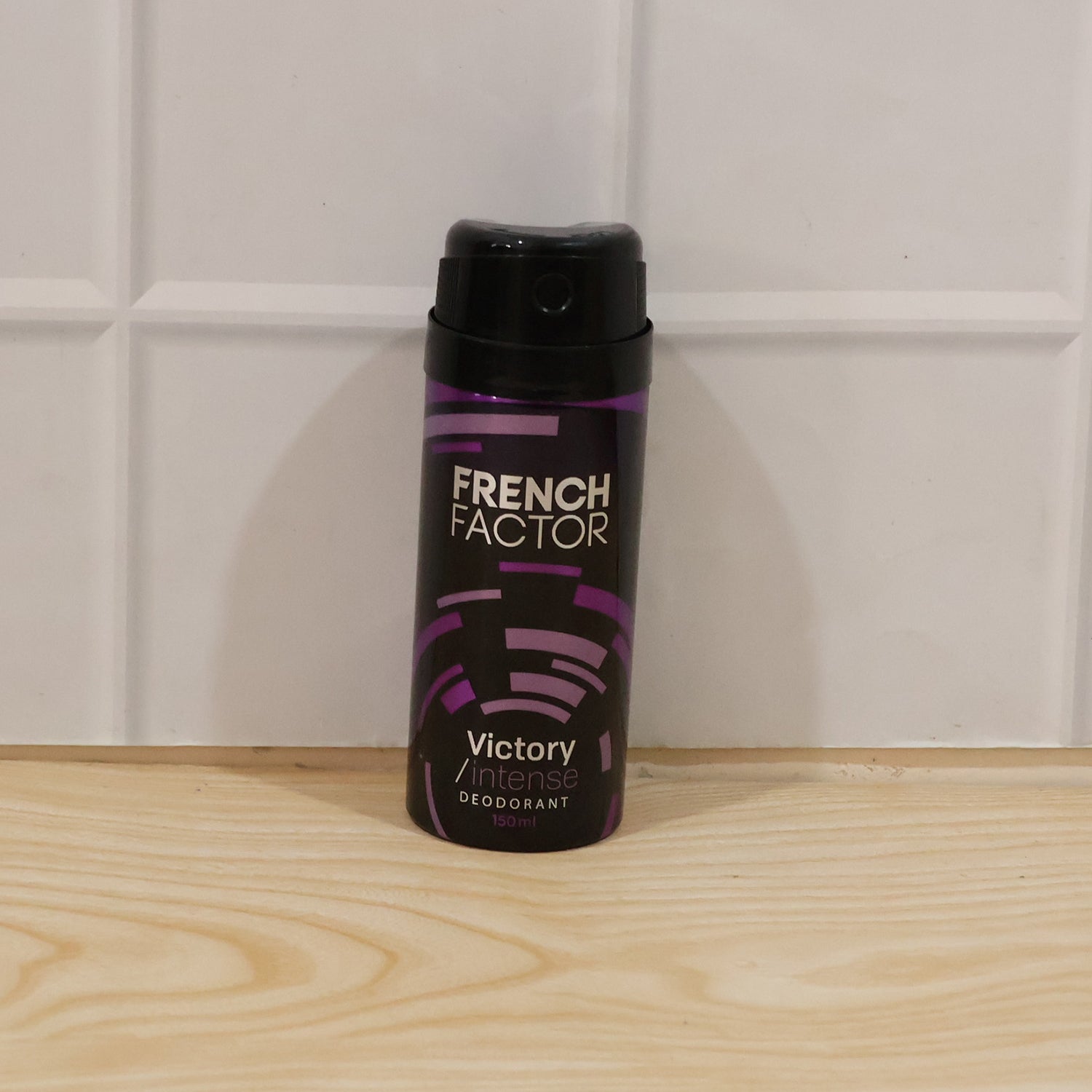 Wukusy French Factor Victory Intense deodorant body spray bottle, 150 ml, with sleek packaging and spray nozzle visible.