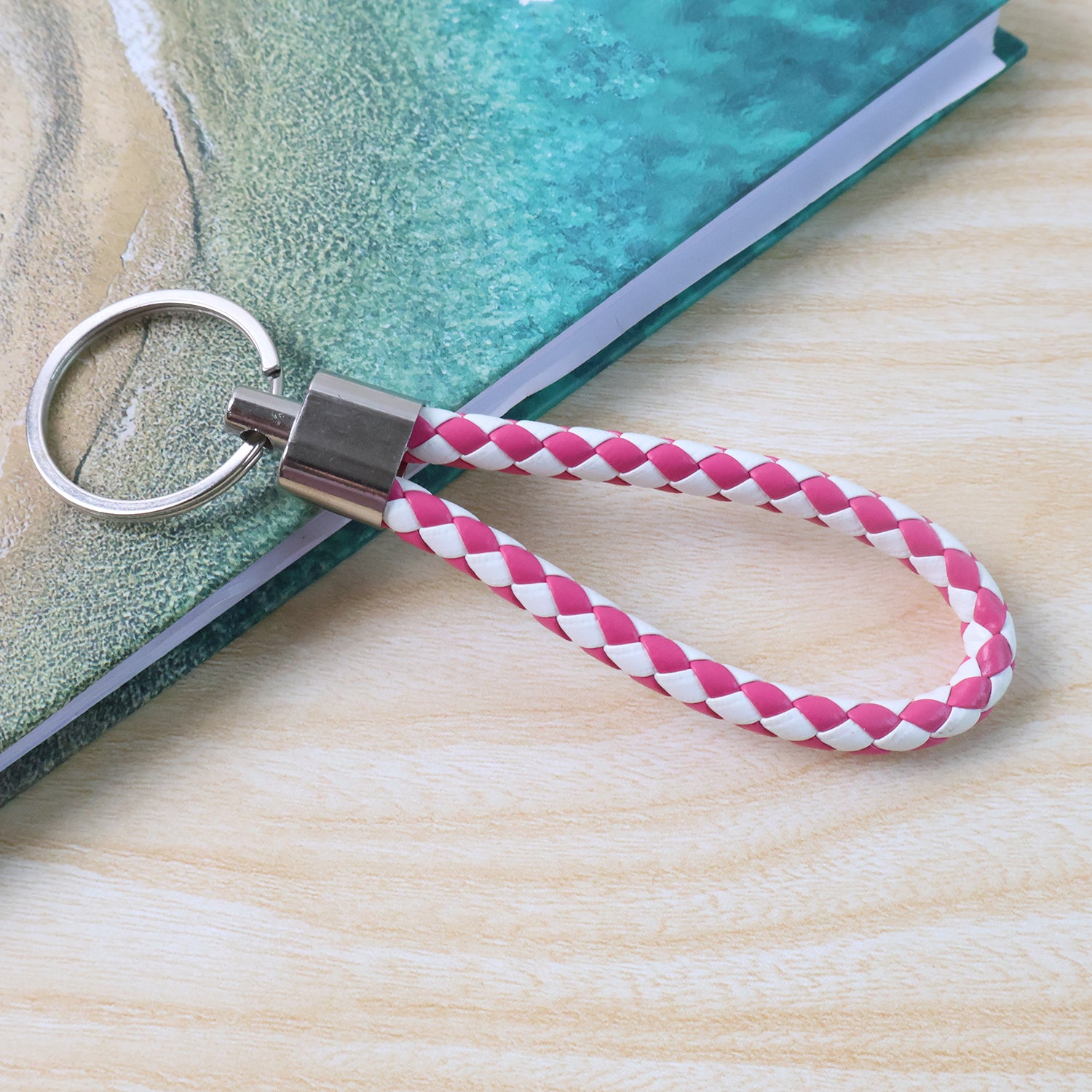 Leather style keychain with metal ring, Wukusy brand, featuring a durable leather strap and metal ring for keys or accessories.