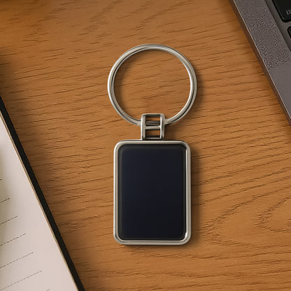 Black rectangular metal keychain with silver accents by Wukusy, showing a sleek and durable design with a keyring attachment.