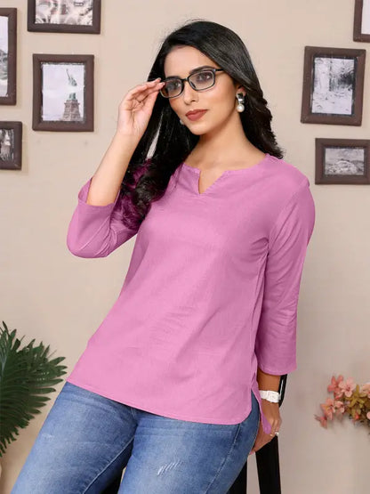Women’s baby pink cotton tunic with round V-neck, hip length, and 3/4 sleeves by Ekom, shown on a model.