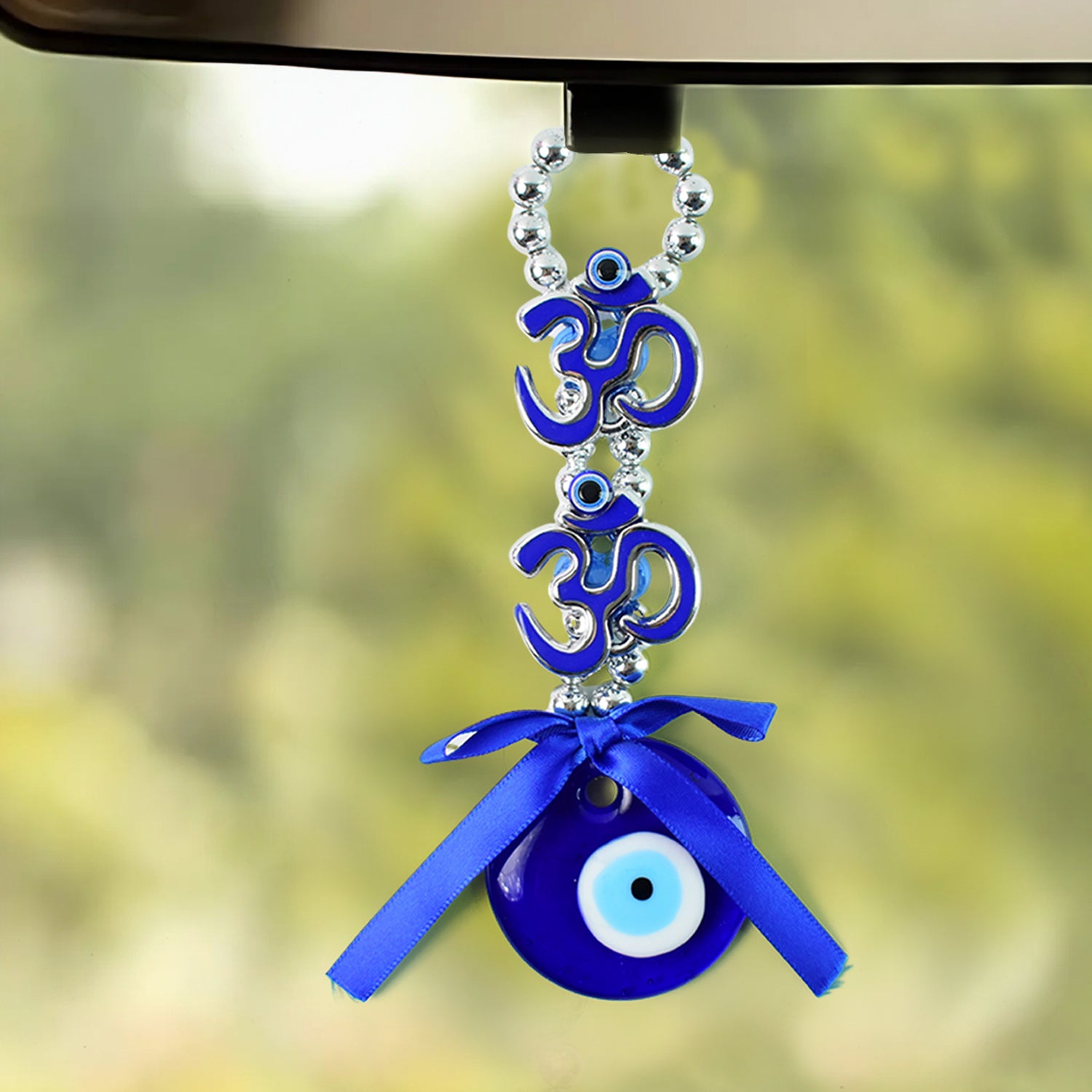 Decorative double Om symbol evil eye hanging ornament by Wukusy with intricate design and vibrant colors.