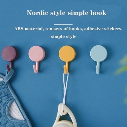 Set of two Wukusy 7473 heavy-duty wall hooks for home use, showing sturdy metal hooks mounted on a wall for hanging items.