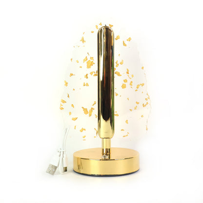 Golden crystal leaf-shaped LED table lamp by Wukusy, elegant home decor piece with intricate leaf design and warm glow.