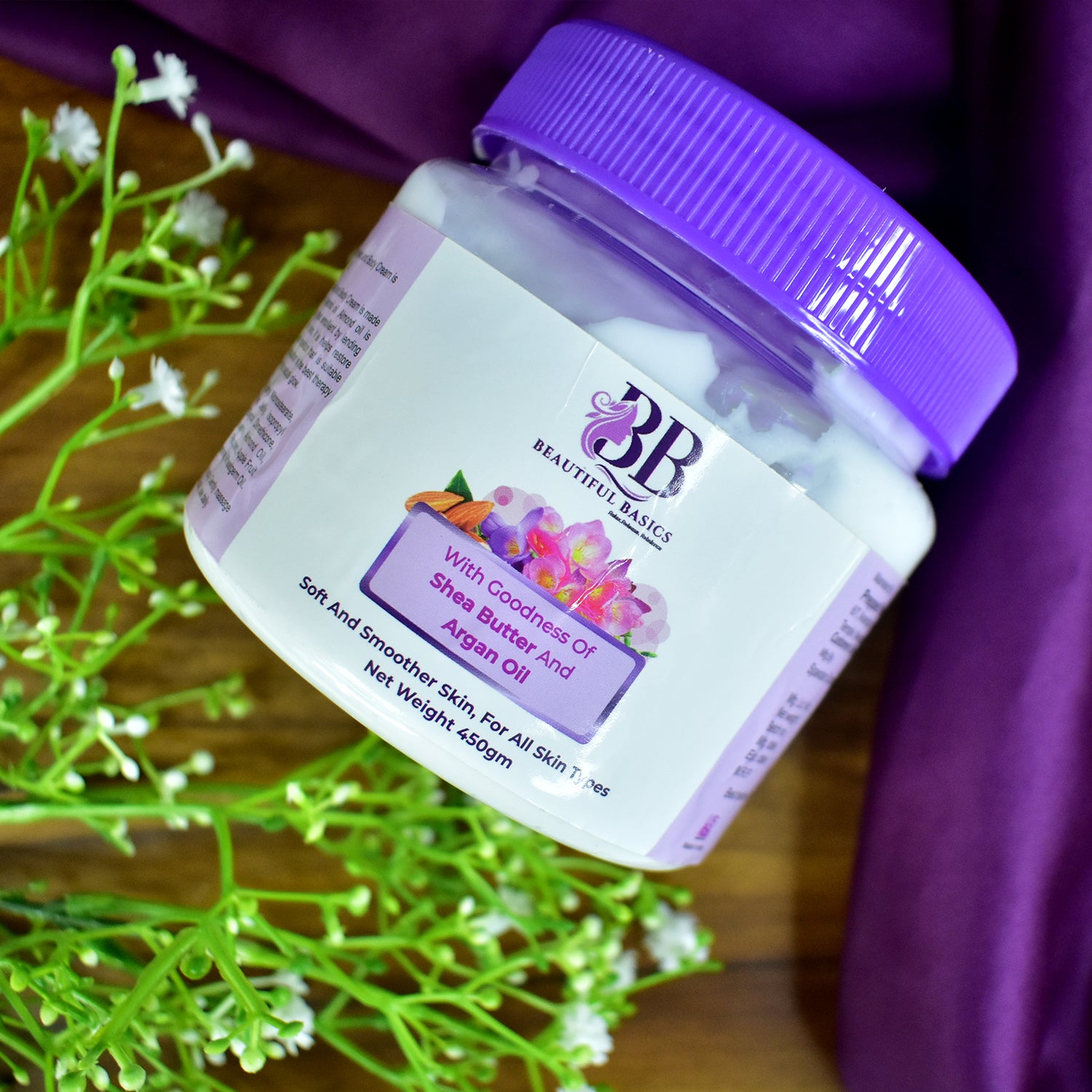 Wukusy Beautiful Basics Shea Butter and Argan Oil Body Cream in 450g jar, creamy moisturizer for smooth, nourished skin.