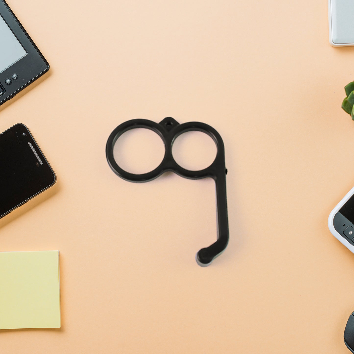 Plastic hand mobile stand in mixed colors by Wukusy, holds smartphones upright for easy viewing.
