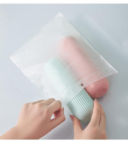 Wukusy 1355 multipurpose capsule-shaped portable storage organizer for travel, compact and lightweight for easy packing.