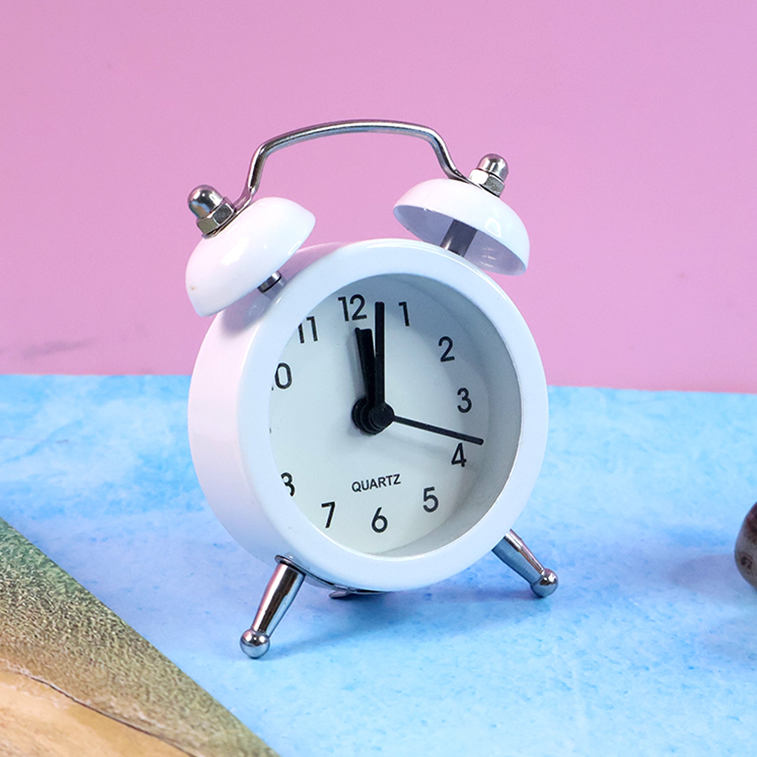Wukusy small twin-bell analog alarm clock with classic design, black and silver finish, and two bells on top for loud ringing.
