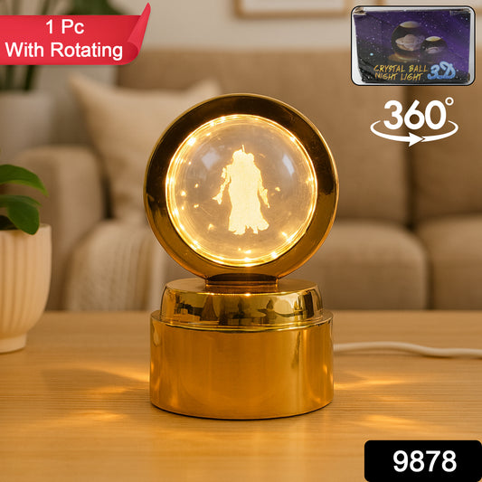 Wukusy Radhe Krishna crystal ball night light on office desk, glowing with intricate religious design in clear glass.