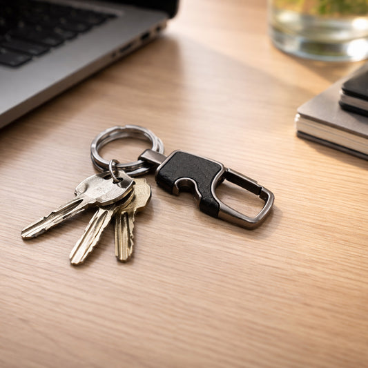Wukusy heavy-duty keychain organizer with quick release hook holding multiple keys on a black metal keyring.