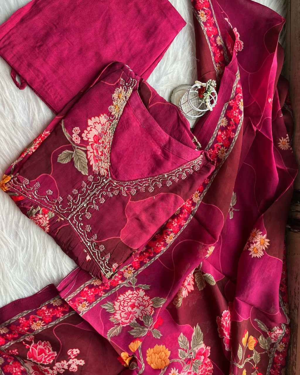 Red embroidered suit from Drpshippr featuring intricate embroidery and a stylish design, displayed on a hanger.