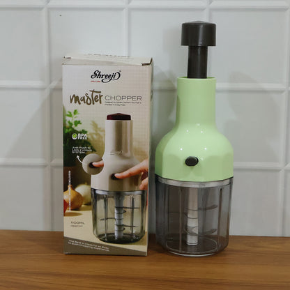 Wukusy manual push vegetable chopper with 1100 ml capacity, featuring stainless steel blades and a clear plastic container.
