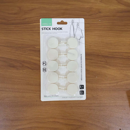 Set of 10 Wukusy self-adhesive round wall hooks for home improvement, mounted on a wall with hooks visible for hanging items.