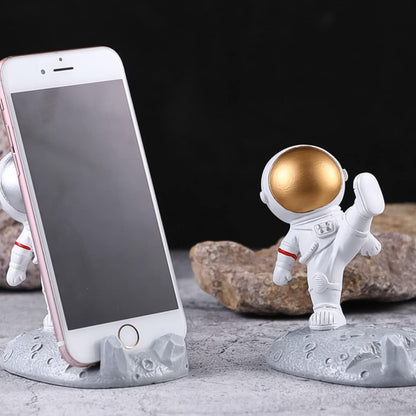 Wukusy astronaut-themed 3D planet mobile phone holder stand, creative space-inspired phone accessory with fun design.
